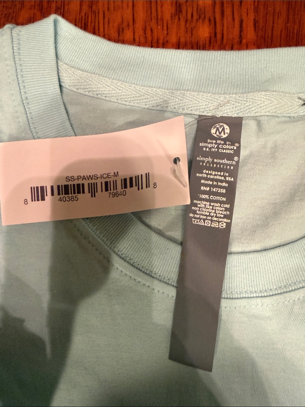 NWT Simply Southern Woman’s Pale Blue Tee with Pink Floral Chest Logo - Picture 2 of 4